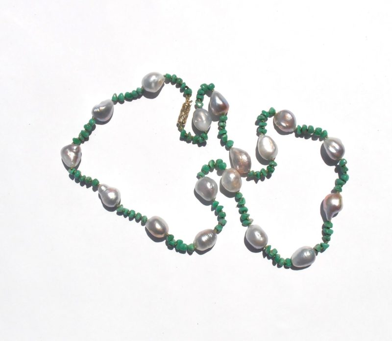 This one-of-a-kind necklace features irregular Baroque freshwater pearls with a white bodycolor and lavender and bluish overtones. The colors are all natural.