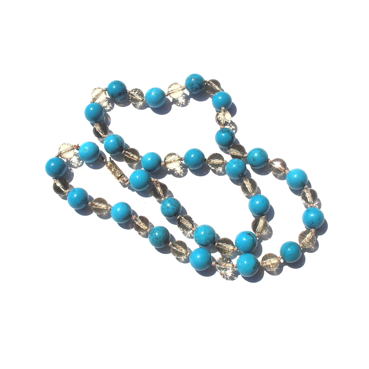 This classic 22 inch necklace combines the dense color of Turquoise with the shimmering champagne colors of pale faceted Citrine.