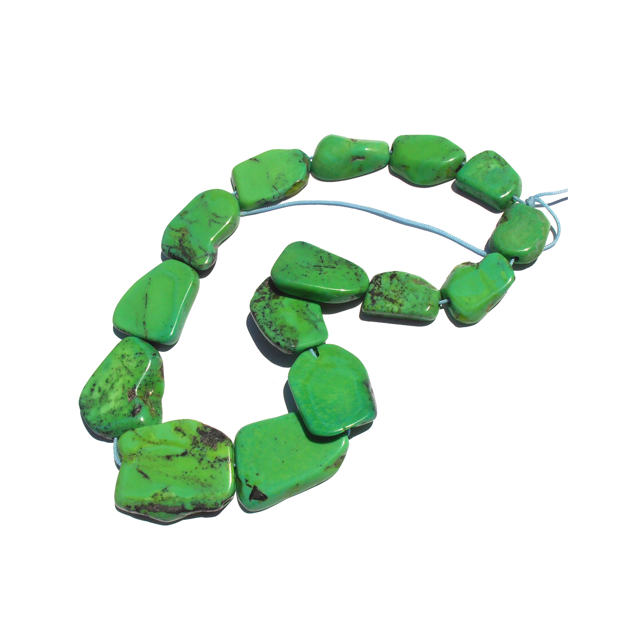 Irregular graduated nugget beads from the famous Carico location in Nevada. Bright parrot green Turquoise. Natural color. American processed. $1,100.-USD