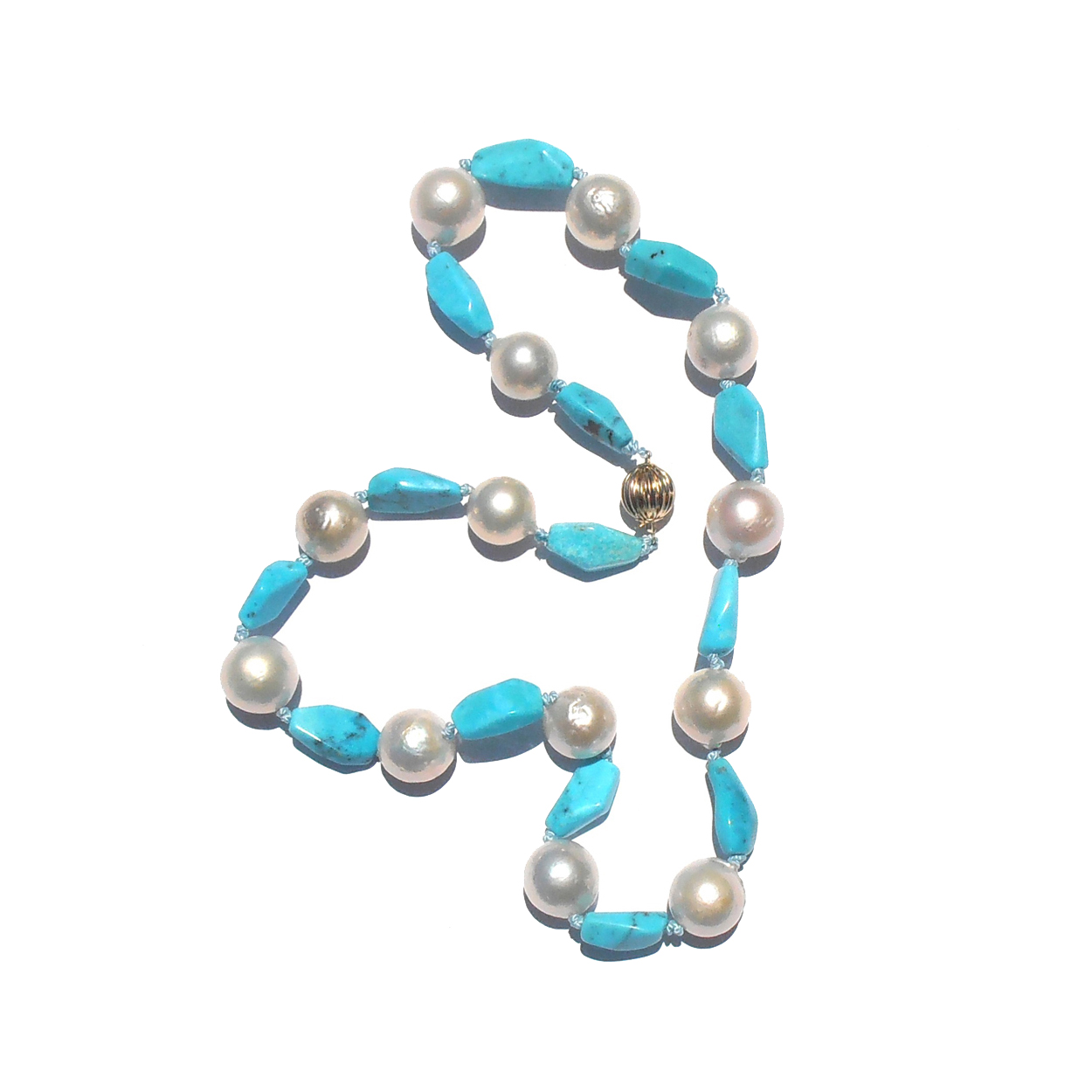 Blue and White. One-of-a-kind Pilot Mountain Turquoise and cultured freshwater pearl necklace. Handknotted on silk with a 14k gold clasp. $2,150.-USD